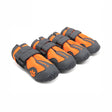 Four orange and gray dog boots on a white background