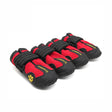 Set of red and black pet shoes with paw design on a white background