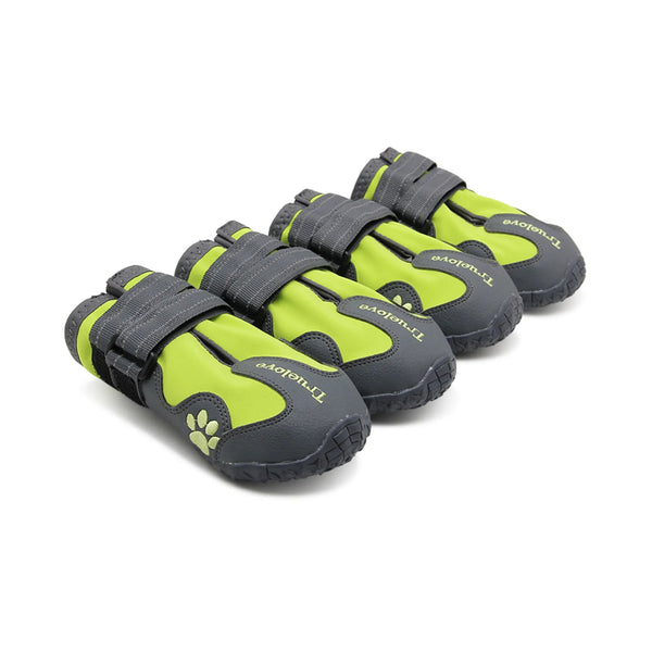 Four green and gray pet shoes with 'TreadTuff' branding on a white background